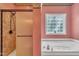 Bright bathroom featuring a soaking tub with glass block window and a glass enclosed shower at 1325 Red Brick Rd, Garner, NC 27529