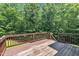 Spacious wooden deck surrounded by lush greenery, providing an ideal outdoor entertainment area at 1325 Red Brick Rd, Garner, NC 27529