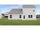The backyard features green grass and an exterior view of the home at 142 Benson Village Dr # 82, Benson, NC 27504