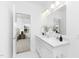 Bright bathroom featuring double sink vanity and a view to bedroom at 142 Benson Village Dr # 82, Benson, NC 27504