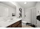 Bathroom with a modern single sink vanity, framed mirror, and a shower-tub combo with a curtain at 142 Benson Village Dr # 82, Benson, NC 27504