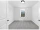 A spacious bedroom featuring carpet and a window at 142 Benson Village Dr # 82, Benson, NC 27504