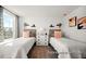 Twin bedroom featuring two beds with stylish headboards, matching nightstands and decorative wall art at 142 Benson Village Dr # 82, Benson, NC 27504