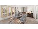 Cozy bedroom featuring stylish chairs, decorative mirrors, and a comfortable bed with elegant furnishings at 142 Benson Village Dr # 82, Benson, NC 27504