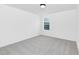 A simple bedroom with carpet and one window at 142 Benson Village Dr # 82, Benson, NC 27504