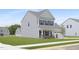 Exterior view of a modern two-story home with gray siding, a well-kept lawn, and simple landscaping at 142 Benson Village Dr # 82, Benson, NC 27504