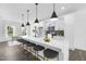 Bright kitchen with a long island, stylish pendant lights, comfortable seating, and modern appliances at 142 Benson Village Dr # 82, Benson, NC 27504