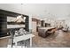 Open concept living and dining area featuring a modern kitchen, dining table, and a cozy seating area at 142 Benson Village Dr # 82, Benson, NC 27504