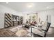 Comfortable living space with modern decor, plush seating, and a large window providing natural light at 142 Benson Village Dr # 82, Benson, NC 27504