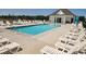 Sparkling community pool surrounded by lounge chairs and a pool house for residents to enjoy at 142 Benson Village Dr # 82, Benson, NC 27504