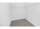 A walk-in closet with white walls and shelving for maximum storage at 142 Benson Village Dr # 82, Benson, NC 27504