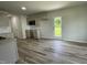 Bright kitchen featuring modern cabinets, sleek countertops and laminate flooring, perfect for cooking at 159 Coharie Dr, Lillington, NC 27546