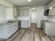 Well-equipped kitchen features modern appliances, sleek countertops, and luxury vinyl flooring at 159 Coharie Dr, Lillington, NC 27546