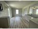 Open-concept kitchen boasts modern appliances, stylish countertops, and laminate flooring, blending style with functionality at 159 Coharie Dr, Lillington, NC 27546