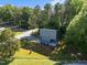 Drone shot showcasing the home's architectural design and beautifully landscaped surroundings at 160 Daphine Dr, Hillsborough, NC 27278
