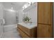 Modern bathroom with double sink vanity, tub, shower, and decorative plants at 160 Daphine Dr, Hillsborough, NC 27278