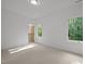Spacious bedroom with plush carpet, large windows, and a walk-in closet at 160 Daphine Dr, Hillsborough, NC 27278