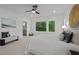 Comfortable bedroom boasts natural light, soft carpet, ensuite bath access, and accent wall art at 160 Daphine Dr, Hillsborough, NC 27278