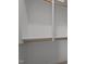 Walk-in closet with built-in shelving and wooden rods for optimal storage solutions at 160 Daphine Dr, Hillsborough, NC 27278