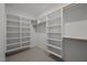 Walk-in closet featuring custom built-in shelving and organization system, maximizing storage at 160 Daphine Dr, Hillsborough, NC 27278