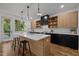 Contemporary kitchen with a central island, modern cabinetry, and stainless steel appliances at 160 Daphine Dr, Hillsborough, NC 27278