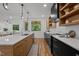 Bright kitchen with modern appliances, a spacious island, and views of the surrounding greenery at 160 Daphine Dr, Hillsborough, NC 27278