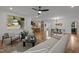 Open-concept living space with modern furnishings, hardwood floors, and seamless flow to the kitchen at 160 Daphine Dr, Hillsborough, NC 27278