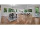 Spacious living and dining areas featuring hardwood floors, abundant natural light, and modern decor at 160 Daphine Dr, Hillsborough, NC 27278