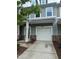 Charming townhome with a one-car garage and well-maintained front yard at 1671 Holly Grove Way, Durham, NC 27713