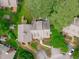 Aerial view of the home with well-manicured lawn and mature landscaping at 1813 Carrington Dr, Raleigh, NC 27615