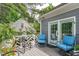 This back deck features blue cushions, white railings, and access to the home through the French doors at 1813 Carrington Dr, Raleigh, NC 27615