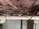 Basement view showing the pink insulation, PVC piping and concrete block walls at 1813 Carrington Dr, Raleigh, NC 27615