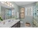 Charming bathroom with custom shower curtain and white tile flooring at 1813 Carrington Dr, Raleigh, NC 27615