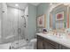 Bathroom featuring a glass-enclosed shower, sleek vanity, and a stylish, framed mirror at 1813 Carrington Dr, Raleigh, NC 27615