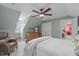 This spacious bedroom features a ceiling fan, neutral walls, and an adjoining doorway to another room at 1813 Carrington Dr, Raleigh, NC 27615