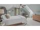 A serene bedroom featuring light green walls, a comfortable bed, and bright natural light at 1813 Carrington Dr, Raleigh, NC 27615