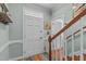 Welcoming entryway with hardwood floors and a staircase leading to upper level of home at 1813 Carrington Dr, Raleigh, NC 27615