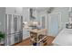 Modern kitchen boasts stainless steel appliances, white cabinetry, and a functional butcher block island at 1813 Carrington Dr, Raleigh, NC 27615