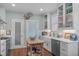 Bright kitchen featuring white cabinetry, stainless steel appliances, and a wooden kitchen island at 1813 Carrington Dr, Raleigh, NC 27615