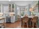 Bright kitchen featuring an island, stainless steel appliances, and bay window with a stained glass accent at 1813 Carrington Dr, Raleigh, NC 27615