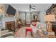 Inviting living room featuring a fireplace, hardwood floors, and comfortable seating at 1813 Carrington Dr, Raleigh, NC 27615