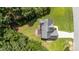 An aerial view of the home showcases its architectural lines and surrounding mature trees at 185 Keller Dr, Clayton, NC 27520