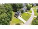 An aerial view highlights this two-story home set back on lush lot at 185 Keller Dr, Clayton, NC 27520