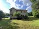 Spacious backyard featuring a wooden deck and lush green lawn, perfect for outdoor enjoyment at 185 Keller Dr, Clayton, NC 27520