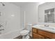 Clean bathroom boasts a shower-tub combo and a wooden vanity with a white countertop at 185 Keller Dr, Clayton, NC 27520