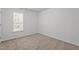 Bedroom featuring a large window and neutral walls at 185 Keller Dr, Clayton, NC 27520