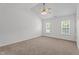 Neutral bedroom with carpeted floor and many windows at 185 Keller Dr, Clayton, NC 27520