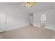Spacious bedroom featuring neutral walls, plush carpet, and ceiling fan at 185 Keller Dr, Clayton, NC 27520