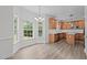 Bright breakfast nook featuring hardwood flooring and lots of natural light at 185 Keller Dr, Clayton, NC 27520