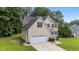 Beautiful two-story home featuring well-kept lawn and a convenient two-car attached garage at 185 Keller Dr, Clayton, NC 27520
